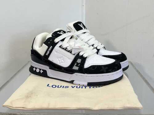 Designer style sneakers in black and white, size 6