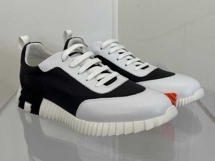 Designer style sneakers in white, black and orange, size EU 44