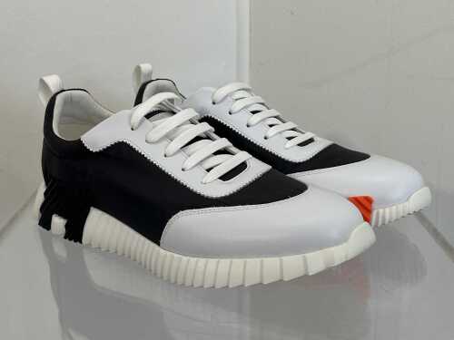 Designer style sneakers in white, black and orange, size EU 44