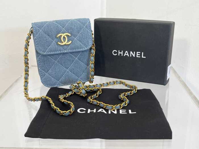 Designer style crossbody bag in blue and gold