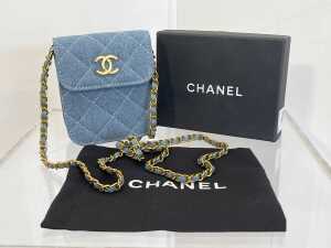 Designer style crossbody bag in blue and gold