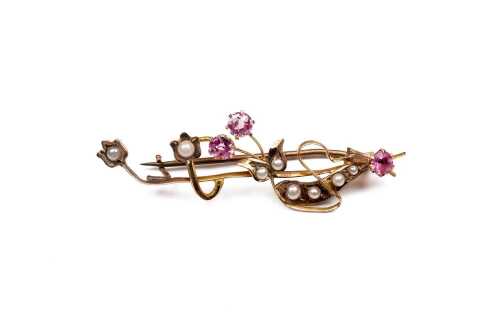 An antique pink tourmaline and seed pearl brooch in 9 carat yellow gold