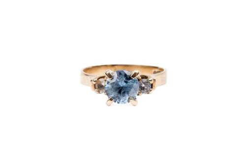 A blue and white topaz ring in 9 carat yellow gold