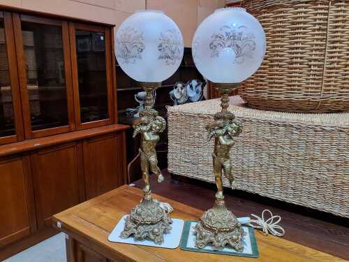 Pair of table lamps with figural cherub columns and etched glass shades