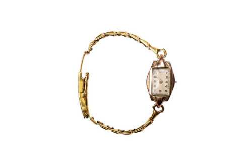 A vintage ladies winding watch in 9 carat yellow gold
