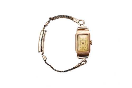 A vintage Omega ladies winding watch in 9 carat yellow gold