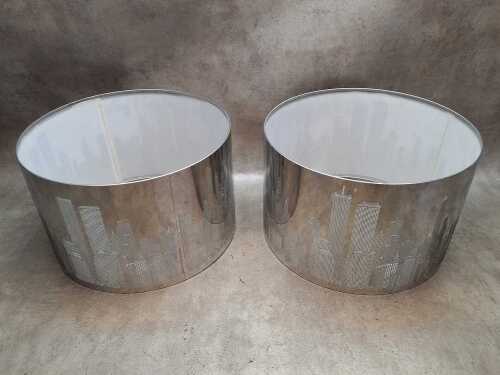 Pair of laser-cut chromed metal lamp shades depicting New York City skyline
