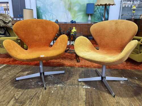Pair of replica Swan swivel armchairs
