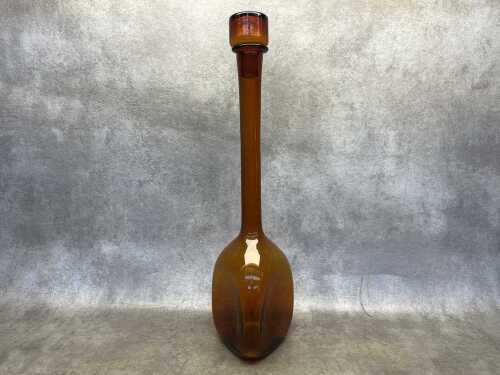 A mid-century amber three-sided genie bottle
