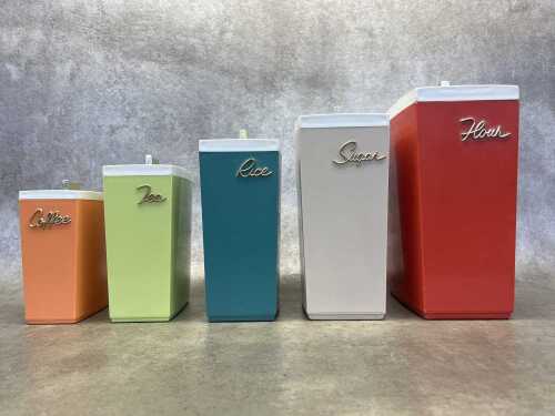 Set of five retro Capri Dylanite nesting kitchen canisters, some with scoops.
