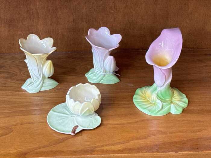 Four Carlton Ware floral form porcelain vases
