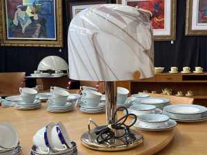 Gold-tone table lamp with marbled glass dome shade