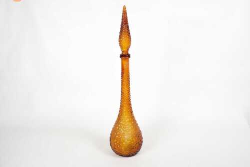 A mid-century hob-nail amber glass Genie bottle