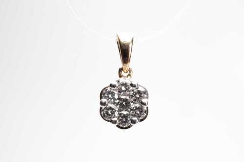 A diamond flower pendant in 9 carat yellow gold