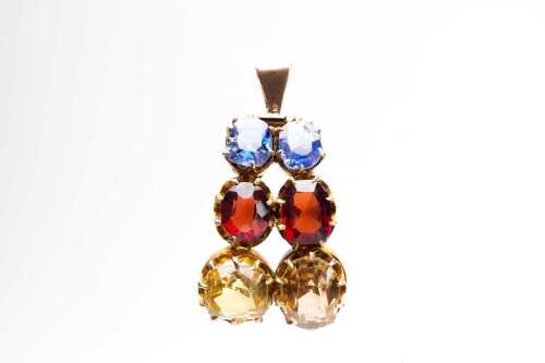 A multi gemstone pendant in 9 carat yellow gold.