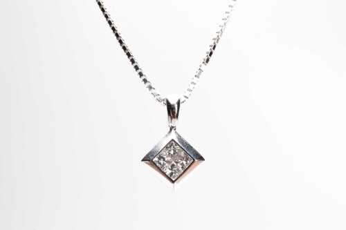 A princess cut diamond pendant in 18 carat white gold on 9 carat white gold chain.