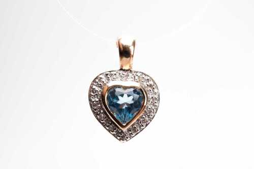 A blue topaz and diamond pendant/enhancer in 9 carat yellow gold.