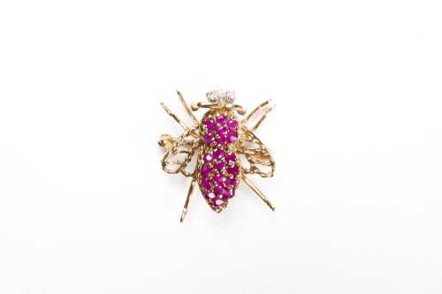 A ruby and diamond fly brooch in 9 carat yellow gold.