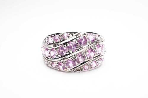 A pink sapphire ring in 9 carat white gold.