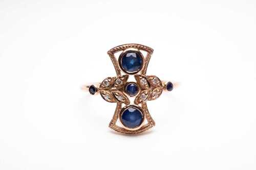 A sapphire and diamond ring in 9 carat yellow gold.