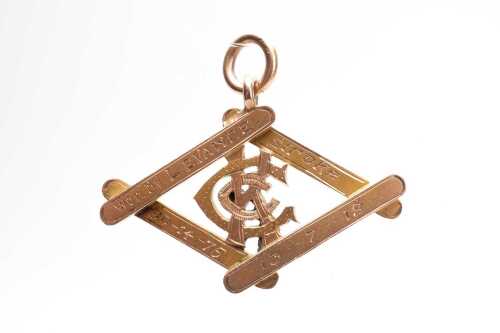 An antique medal pendant in 9 carat yellow gold