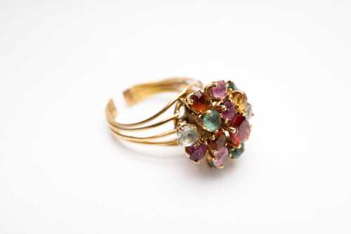 A vintage multi coloured quartz and garnet cluster ring in 18ct yellow gold.