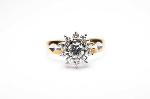 A diamond ring in 18 carat yellow gold and palladium.