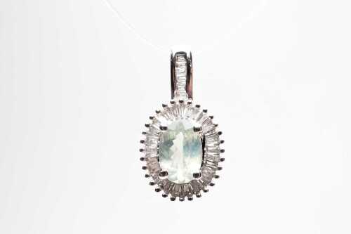 An alexandrite and diamond pendant in 14 carat white gold.