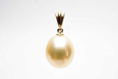 A cultured pearl pendant in 18 carat yellow gold.