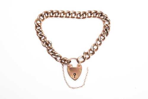 A vintage curb link padlock bracelet in 9ct carat rose gold