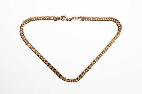 An Italian curb link bracelet in 9 carat yellow gold.