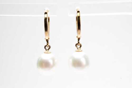 A pair of South sea cultured pearl drop earrings in 14 carat yellow gold