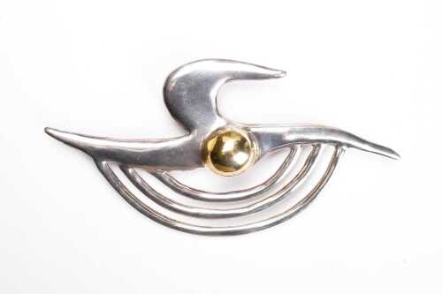 A vintage abstract brooch in sterling silver and gold-plate.
