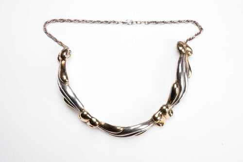 A vintage necklace in sterling silver and gold-plate.