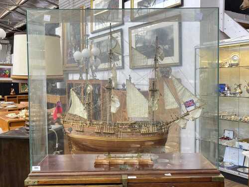 Model of HMS Endeavour sailing ship in glass case