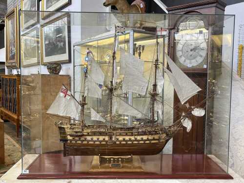 Model of the HMS Victory sailing ship in glass case