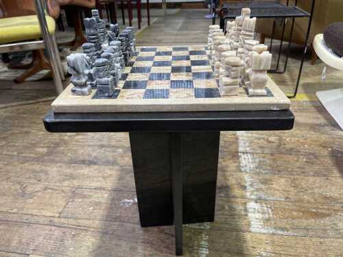 Mexican Onyx chessboard on marble table with carved pieces