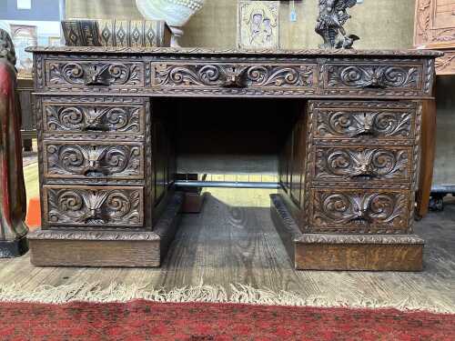 Antique oak pedestal desk with nine drawers