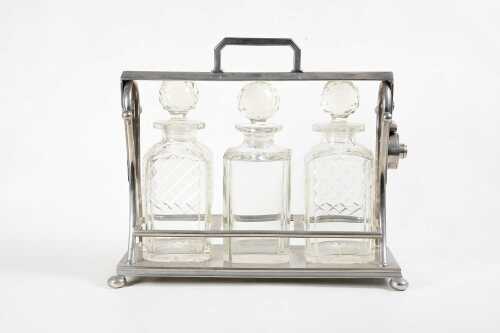 Antique nickel-plated tantalus with key