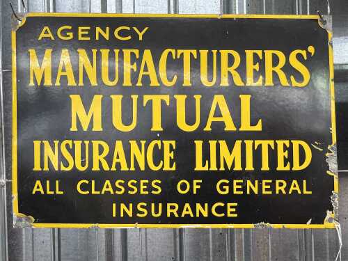 A vintage Manufacturers' Mutual Insurance Limited enamel sign.