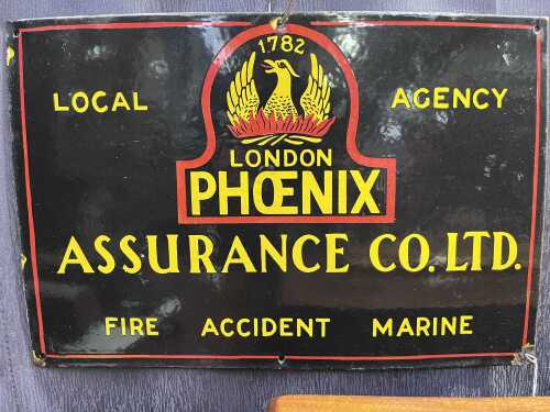 A vintage Phoenix Assurance Co enamel sign.