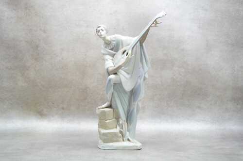 A Lladro lute player porcelain figure