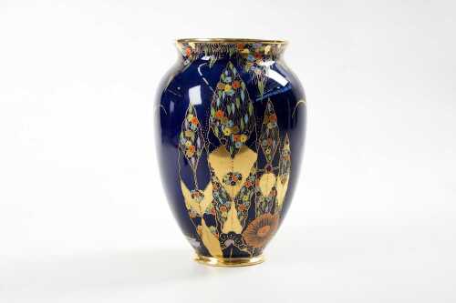 A Carlton Ware hand painted porcelain vase in blue with gilding