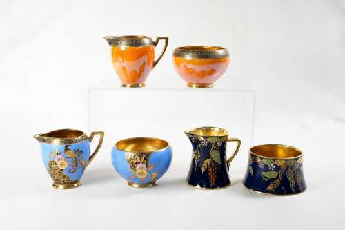 Three Carlton Ware porcelain creamer and sugar bowl sets