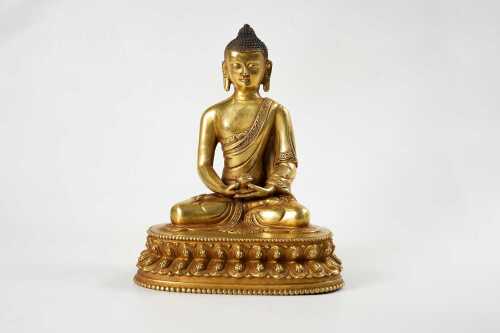 A gilt-bronze figure of Buddha statue
