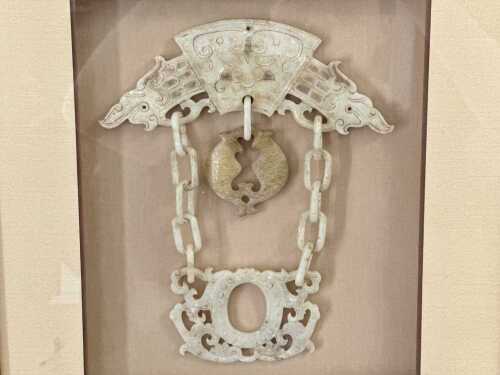 A framed Chinese carved jade assemblage