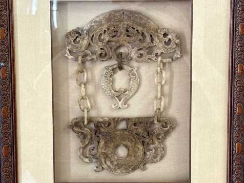 A framed Chinese carved jade assemblage