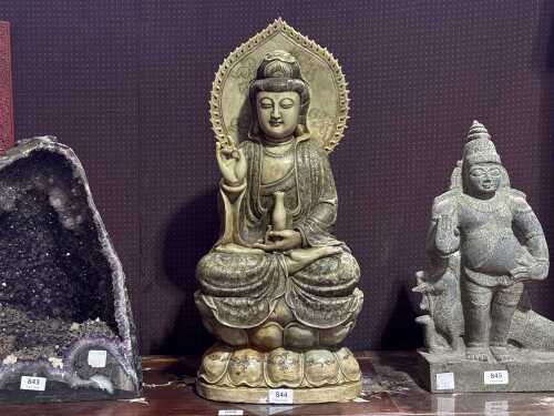 A celadon jade figure of 'Guan Yin' seated in lotus base