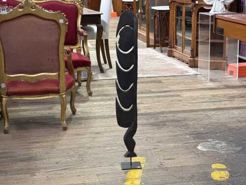 Traditional Papua New Guinea carved timber spirit figure (kamanggabi) on stand.