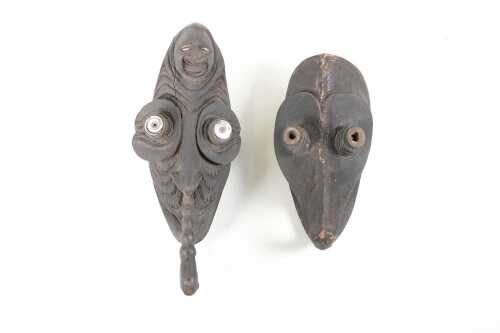 Two traditional Papua New Guinea carved timber crocodile (Waken) spirit masks.